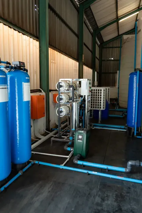 Reverse osmosis plant with blue filter tanks in a treatment plant room