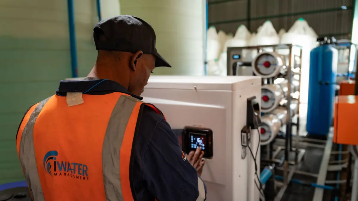Water testing technician sampling borehole supply at a sectional title scheme for SANS 241 compliance reporting for body corporate trustees