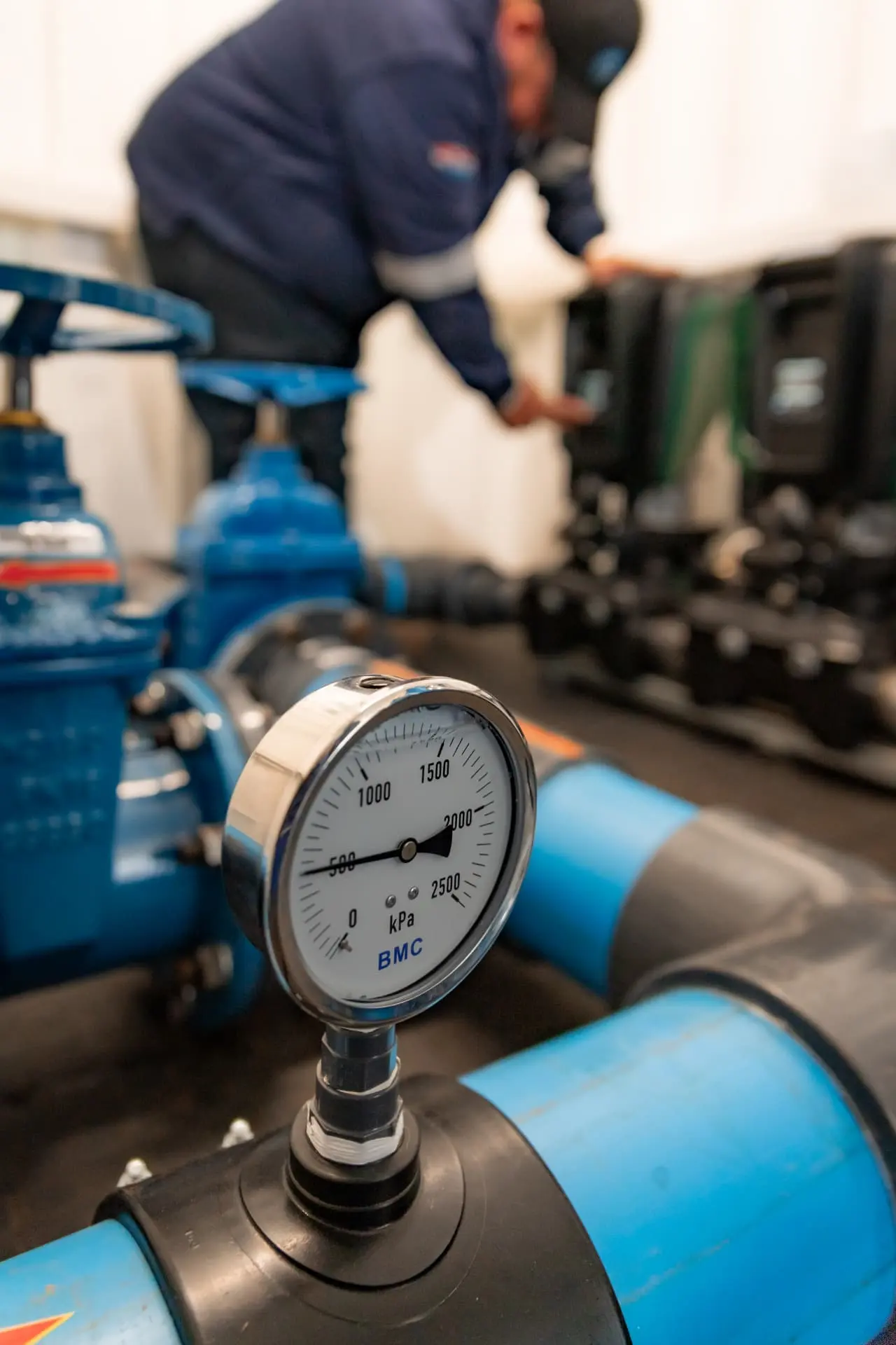 Technician checking pressure on a DAB pump system
