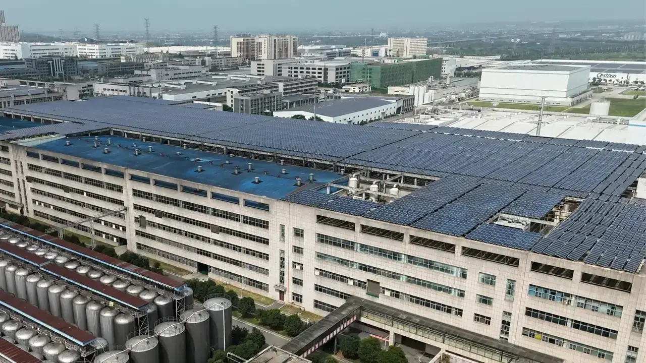 Industrial solar panels installed on a rooftop powering a water system, showcasing sustainable energy for reliable water supply.