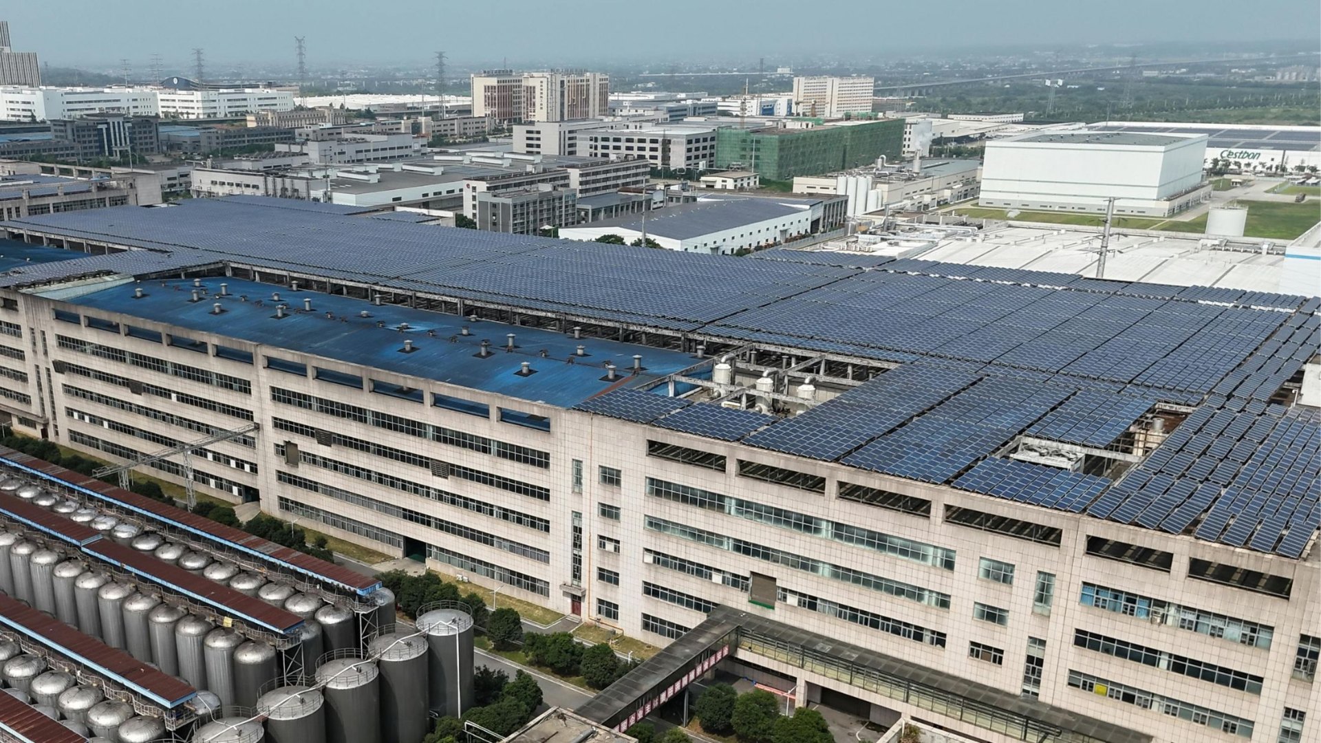 Industrial solar panels installed on a rooftop powering a water system, showcasing sustainable energy for reliable water supply.
