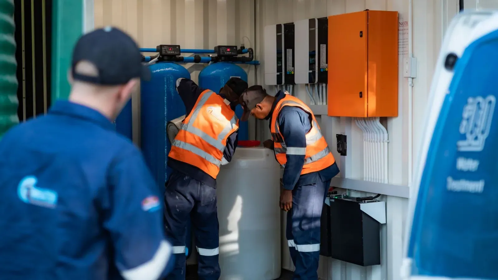 Containerized water treatment plant being installed at a remote operations site, showcasing modular treatment infrastructure.
