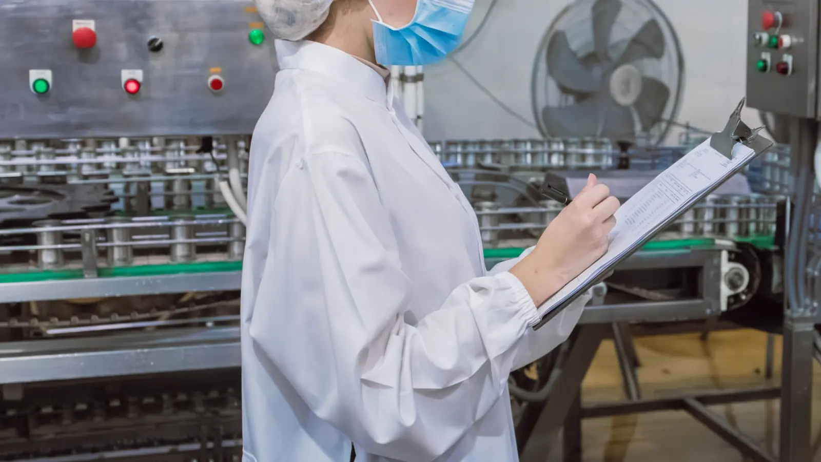 Water quality technician testing process water at a South African food and beverage production facility for SANS 241 compliance and export certification