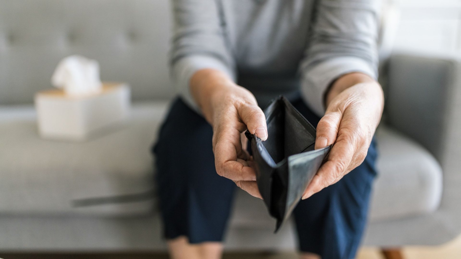 A close-up of empty hands or an empty wallet, symbolising the significant financial cost of water downtime for South African businesses.