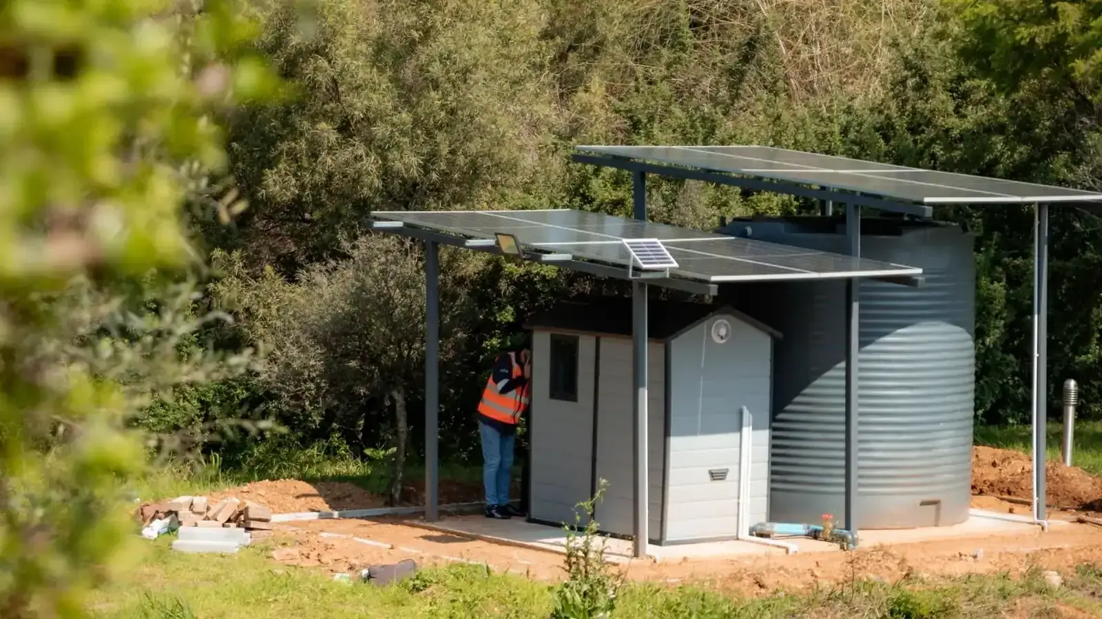 Solar-powered water treatment station in a rural Northern Cape community near Kimberley, providing clean drinking water.