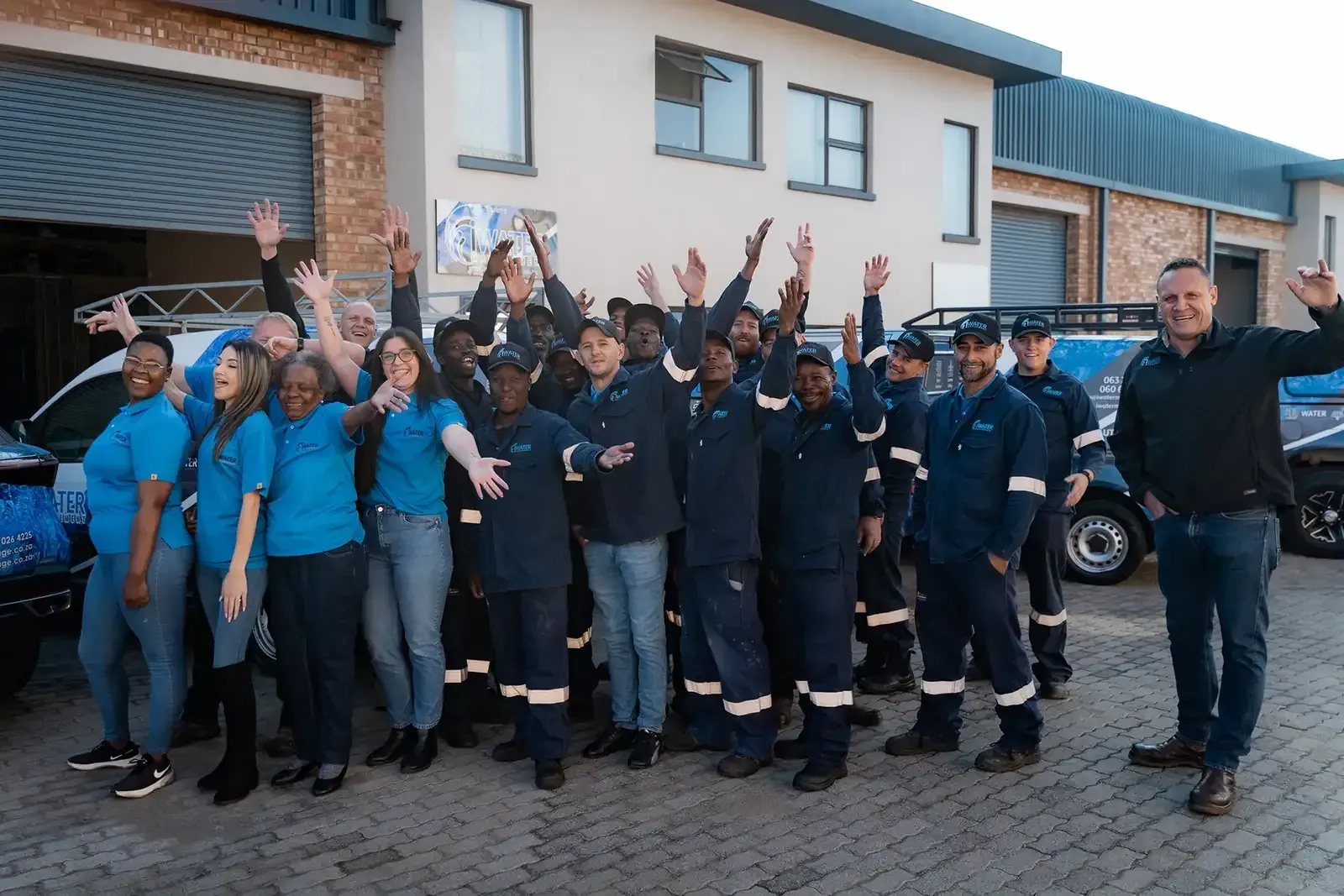 iWater team close-up waving